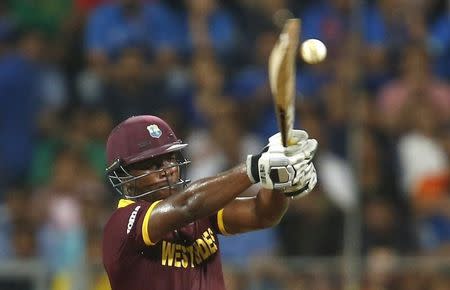 Cricket - West Indies v India - World Twenty20 cricket tournament semi-final - Mumbai, India - 31/03/2016. West Indies Johnson Charles plays a shot. REUTERS/Danish Siddiqui