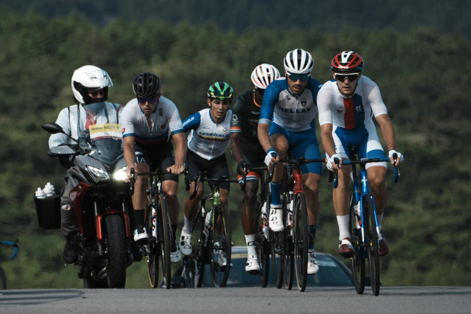 Riders in the breakaway climb during the men's cycling road race at the 2020 Summer Olympics, Saturday, July 24, 2021, in Oyama, Japan. (AP Photo/Thibault Camus)