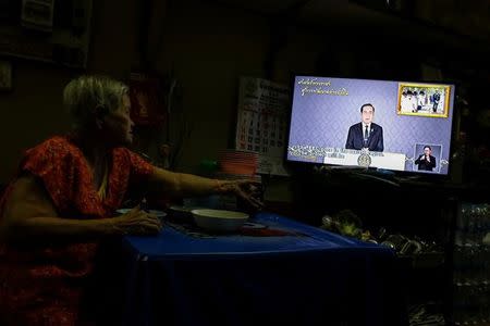 A woman watch Thailand Prime Minister Prayuth Chan-ocha during his weekly TV broadcast in Bangkok, Thailand, May 19, 2017. Picture taken May 19, 2017. REUTERS/Jorge Silva