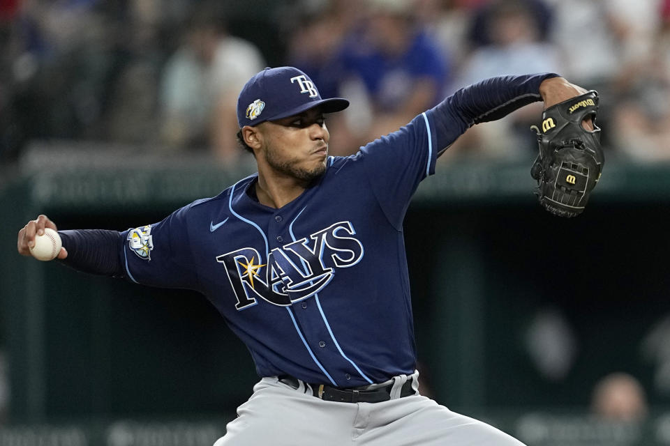 Tampa Bay Rays starting pitcher Taj Bradley throws to a Texas Rangers batter during the fifth inning of a baseball game Tuesday, July 18, 2023, in Arlington, Texas. (AP Photo/Tony Gutierrez)