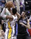 Orlando Magic forward Hedo Turkoglu, right, blocks the shot of Indiana Pacers forward Danny Granger during the first half of the second game of an NBA first-round playoff basketball series, in Indianapolis on Monday, April 30, 2012. (AP Photo/Michael Conroy)