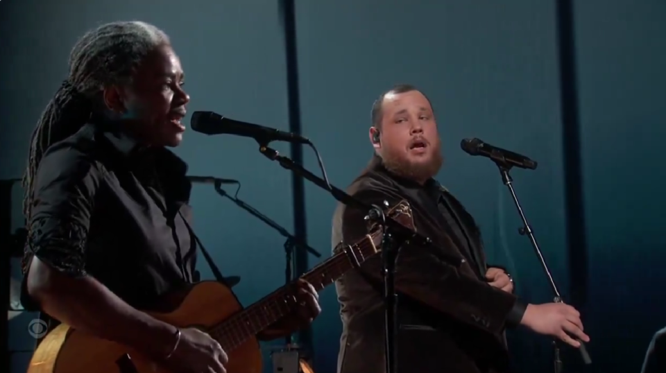 Tracy Chapman receives flowers during the Grammy performance of "Fast Car" with Luke Combs.