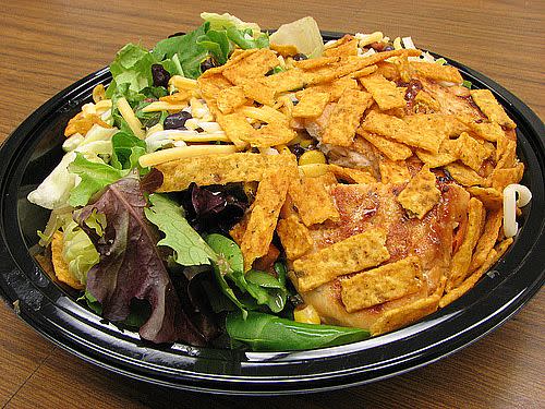 The premium southwest salad with grilled chicken contains 290 calories (if you choose the crispy chicken, the salad is 450 calories). Add another 100 calories if you add the Newman's Own creamy southwest dressing.