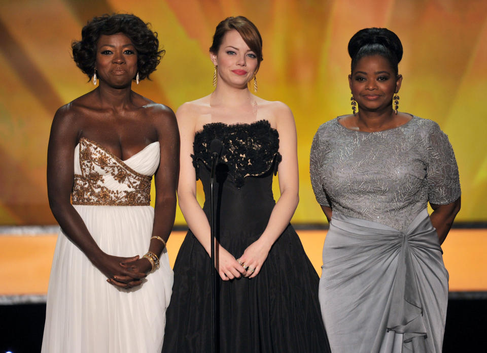 Viola Davis, Emma Stone, and Octavia Spencer speak onstage during the 18th Annual Screen Actors Guild Awards&nbsp;in 2012.&nbsp;