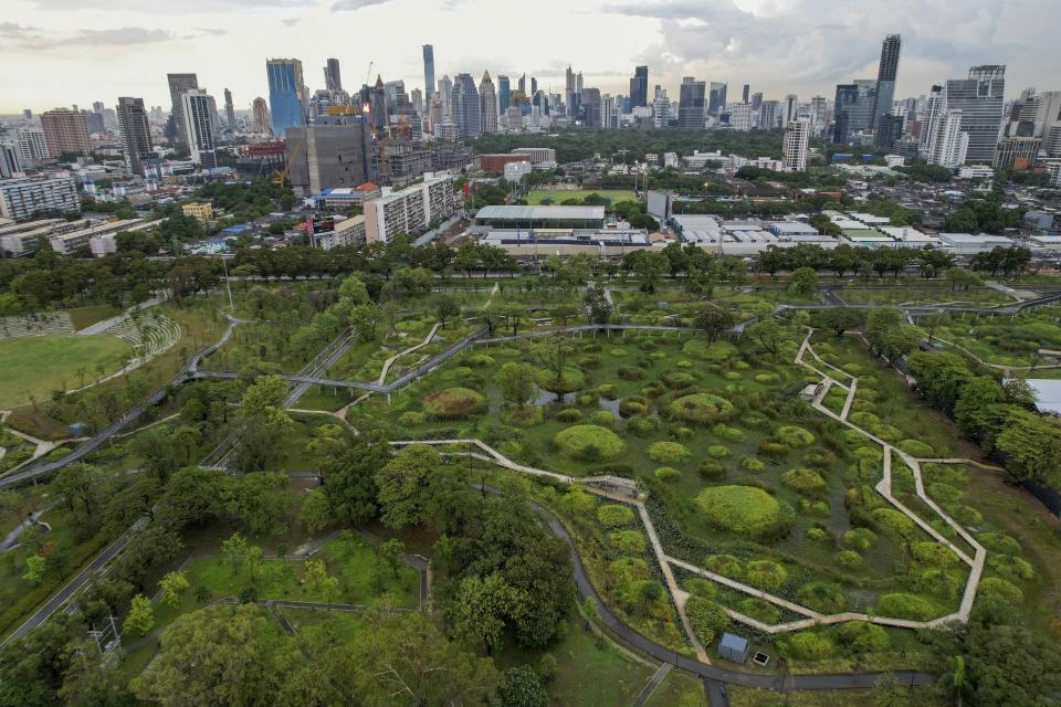 This photo shows a general view of Benjakitti Park in Bangkok, Thailand, Sunday, May 8, 2022. Bursting with trees, ponds, plants and birdlife, the new inner-city park is delighting residents of Thailand’s bustling, congested capital. (AP Photo/Krit Phromsakla Na Sakolnakorn) | AP