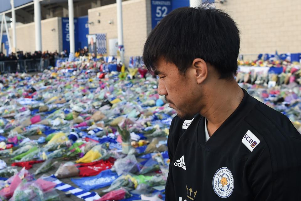 Leicester City’s Japanese striker Shinji Okazaki looks at the floral tributes (Photo by Mike Egerton/PA Images via Getty Images)