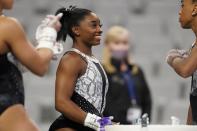 Simone Biles talks with teammates during warmups before the U.S. Gymnastics Championships, Sunday, June 6, 2021, in Fort Worth, Texas. (AP Photo/Tony Gutierrez)