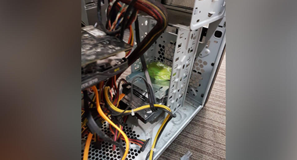 The frog was inside a computer in a store at a Queensland shopping centre. Source: King IT/ Facebook