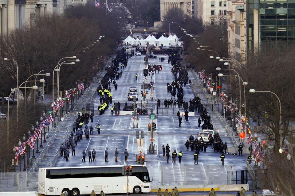 Security is set up along Pennsylvania Avenue before the 59th Presidential Inauguration at the U.S. Capitol in Washington, Wednesday, Jan. 20, 2021. (AP Photo/Carolyn Kaster)