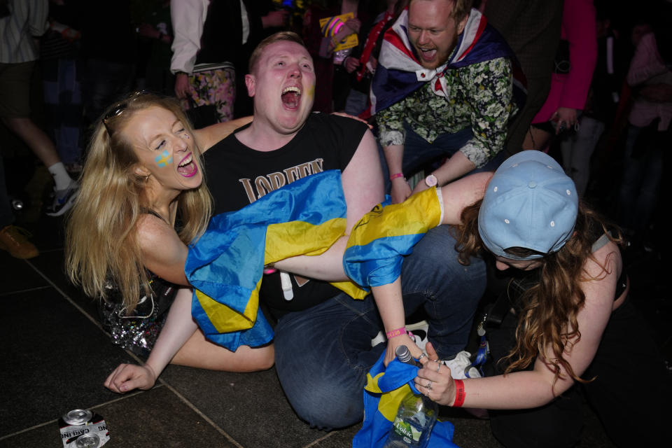 Swedish Eurovision fans in the Fan Zone react as Loreen of Sweden wins Grand Final of the Eurovision Song Contest in Liverpool, England, Saturday, May 13, 2023. (AP Photo/Jon Super)