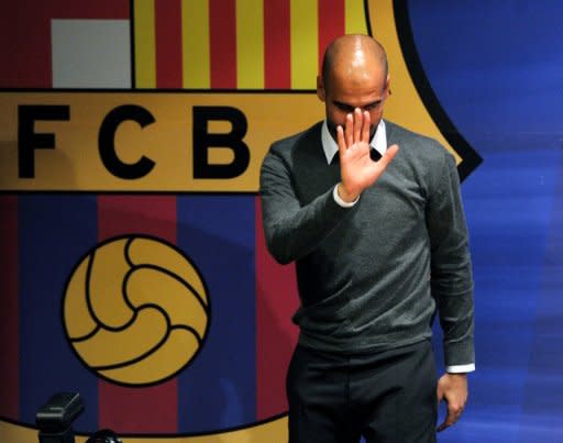 Barcelona's coach Josep Guardiola, pictured during a press conference in Barcelona, on April 27. Spanish hopes of a mouth watering Champions League final between Real Madrid and Barcelona evaporated this week with both sides crashing out at the semi final stage but at least Real have the consolation of being on the verge of claiming their first la liga title since 2008