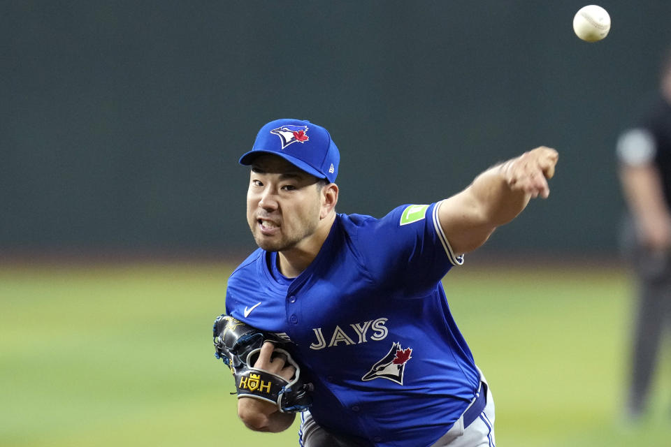 Toronto Blue Jays pitcher Yusei Kikuchi, of Japan, warms up during the first inning of a baseball game against the Arizona Diamondbacks, Sunday, July 14, 2024, in Phoenix. (AP Photo/Ross D. Franklin)