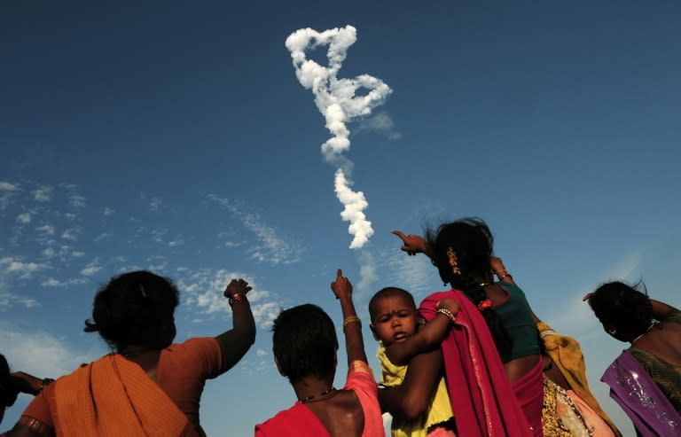 <p>Indian bystanders look on as Space Research Organisation’s (ISRO) satellite INSAT-3DR, on board the Geosynchronous Satellite Launch Vehicle (GSLV-F05) launches from Sriharikota on September 8, 2016. </p>