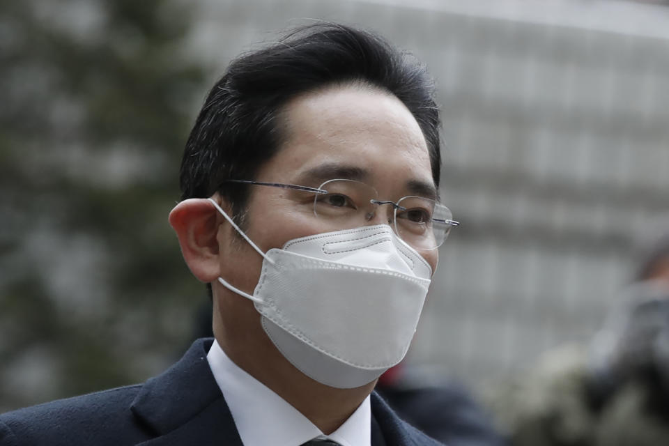 Samsung Electronics Vice Chairman Lee Jae-yong arrives at the Seoul High Court in Seoul, South Korea, Monday, Jan. 18, 2021. South Korean court sentences Lee to 2 and a half years in prison over corruption case. (AP Photo/Lee Jin-man)