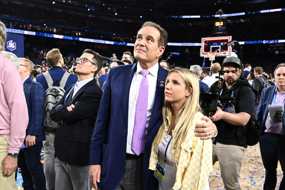 Jim Nantz watches the net-cutting ceremony with his daughter after the <a class="link " href="https://sports.yahoo.com/ncaaw/teams/connecticut/" data-i13n="sec:content-canvas;subsec:anchor_text;elm:context_link" data-ylk="slk:Connecticut Huskies;sec:content-canvas;subsec:anchor_text;elm:context_link;itc:0">Connecticut Huskies</a> defeated the San Diego State Aztecs to win the NCAA Men’s Basketball Tournament National Championship at NRG Stadium on April 03, 2023, in <a class="link " href="https://sports.yahoo.com/ncaaw/teams/houston/" data-i13n="sec:content-canvas;subsec:anchor_text;elm:context_link" data-ylk="slk:Houston;sec:content-canvas;subsec:anchor_text;elm:context_link;itc:0">Houston</a>, Texas. (Photo by Brett Wilhelm/NCAA Photos via Getty Images)