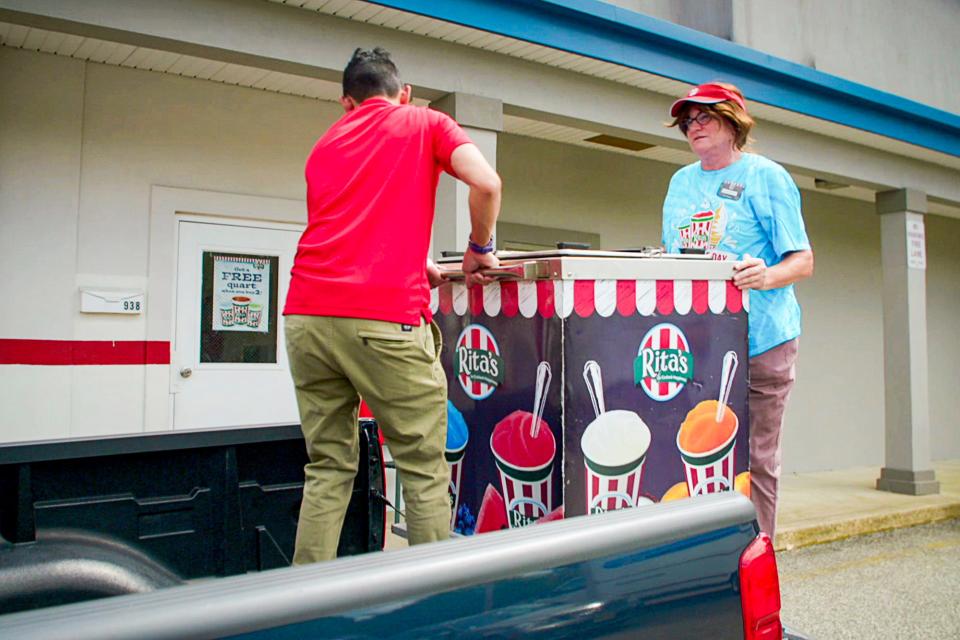 Hezrron Gonzales, left, owner of the Toms River Rita's Italian Ice franchise, works with Linda Chadwick, who unbeknownst to him is actually the president and CEO of the company. They appear on an episode of "Undercover Boss" on CBS. Photo: Screen Grab/CBS ©2021 CBS Broadcasting, Inc. All Rights Reserved