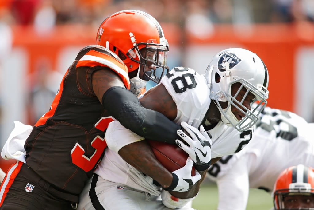 Sep 27, 2015; Cleveland, OH, USA;  Cleveland Browns free safety Tashaun Gipson (39) tackles Oakland Raiders running back Latavius Murray (28) during the second quarter at FirstEnergy Stadium. Mandatory Credit: Scott R. Galvin-USA TODAY Sports