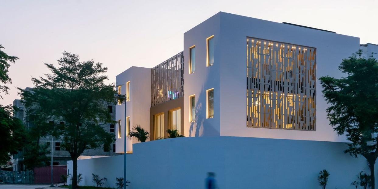 exterior of modern building bathed in blue light