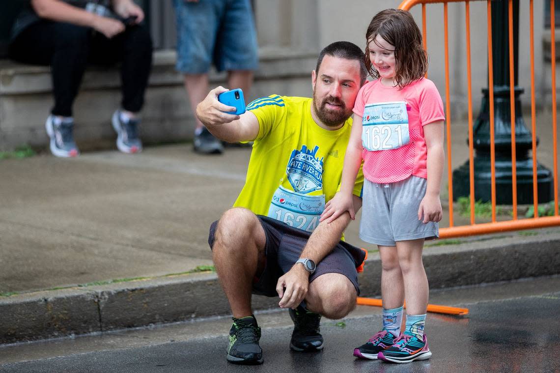 Peter Harper (left) and M. Harper (right) pose for a photo together before last year’s Midsummer Night’s Run in downtown Lexington.