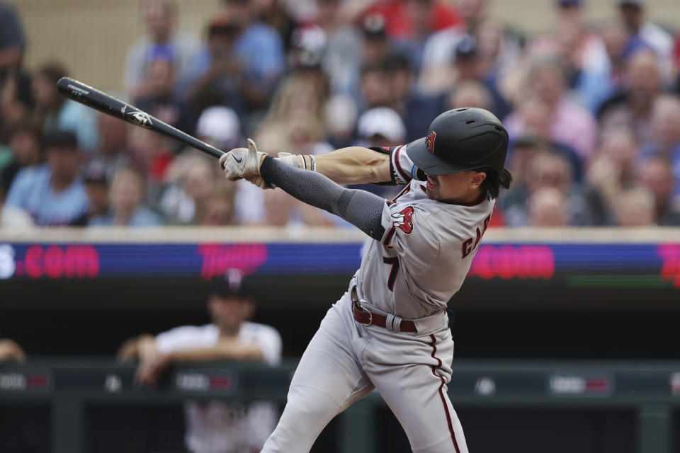 Arizona Diamondbacks' Corbin Carroll hits a double during the first inning of the team's baseball game against the Minnesota Twins, Friday, Aug. 4, 2023, in Minneapolis. (AP Photo/Stacy Bengs)
