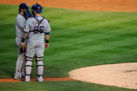 DETROIT, MI - OCTOBER 13: Mike Napoli #25 speaks with C.J. Wilson #36 of the Texas Rangers during Game Five of the American League Championship Series against the Detroit Tigers at Comerica Park on October 13, 2011 in Detroit, Michigan. (Photo by Kevork Djansezian/Getty Images)