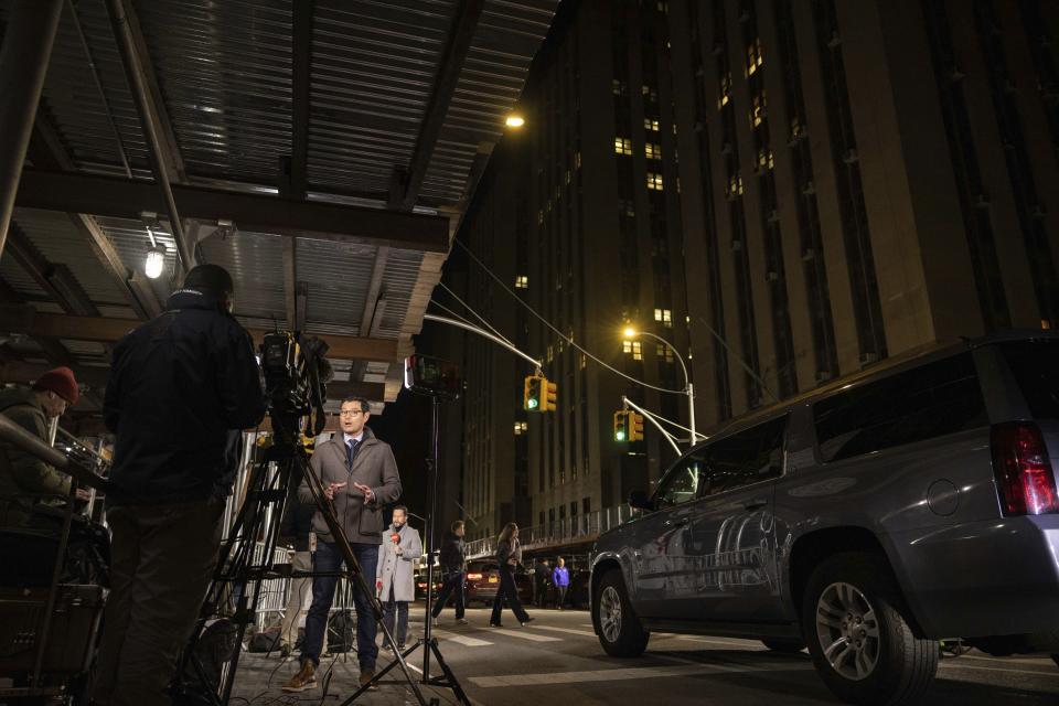 Members of the media are seen outside Manhattan Criminal Court in New York, Thursday, March 30, 2023. Donald Trump has been indicted by a Manhattan grand jury, prosecutors and defense lawyers said Thursday, making him the first former U.S. president to face a criminal charge and jolting his bid to retake the White House next year. (AP Photo/Yuki Iwamura)