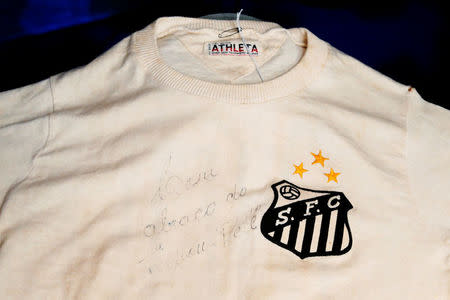 An autographed shirt wore by Pele during a match between Santos and Chelsea in 1971 is displayed by Julien's Auctions in New York City, U.S., December 1, 2016. REUTERS/Brendan McDermid