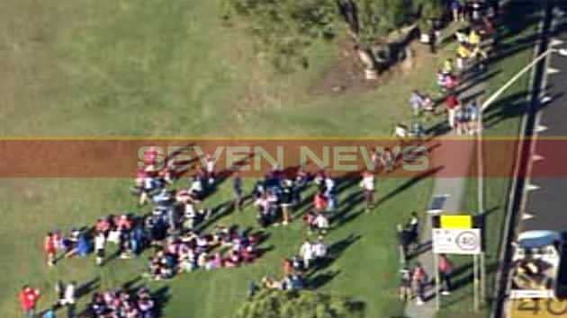 Pictures captured by the 7News helicopter show people gathering at a nearby park. Photo: 7News