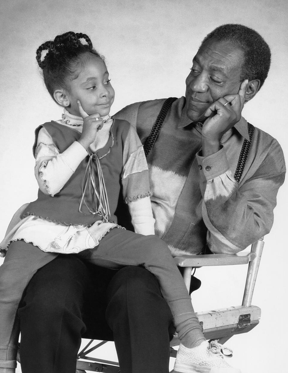 THE COSBY SHOW -- Season 7 -- Pictured: (l-r) Raven-SymonT Pearman as Olivia Kendall, Bill Cosby as Dr. Heathcliff 'Cliff' Huxtable  (Photo by Alan Singer/NBCU Photo Bank/NBCUniversal via Getty Images via Getty Images)