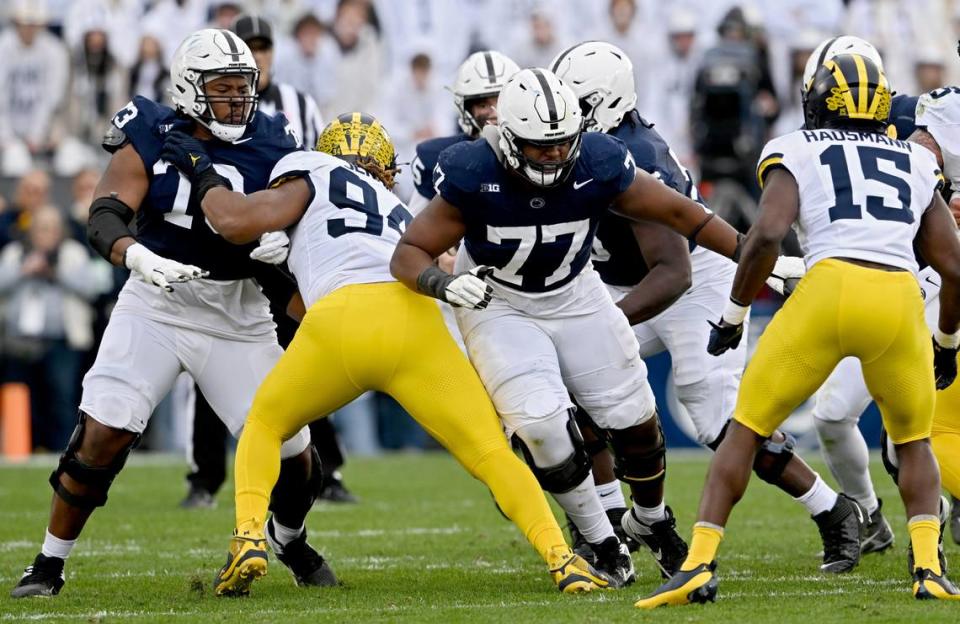 Penn State offensive linemen Caedan Wallace and Sal Wormley stop Michigan defense during the game on Saturday, Nov. 11, 2023.