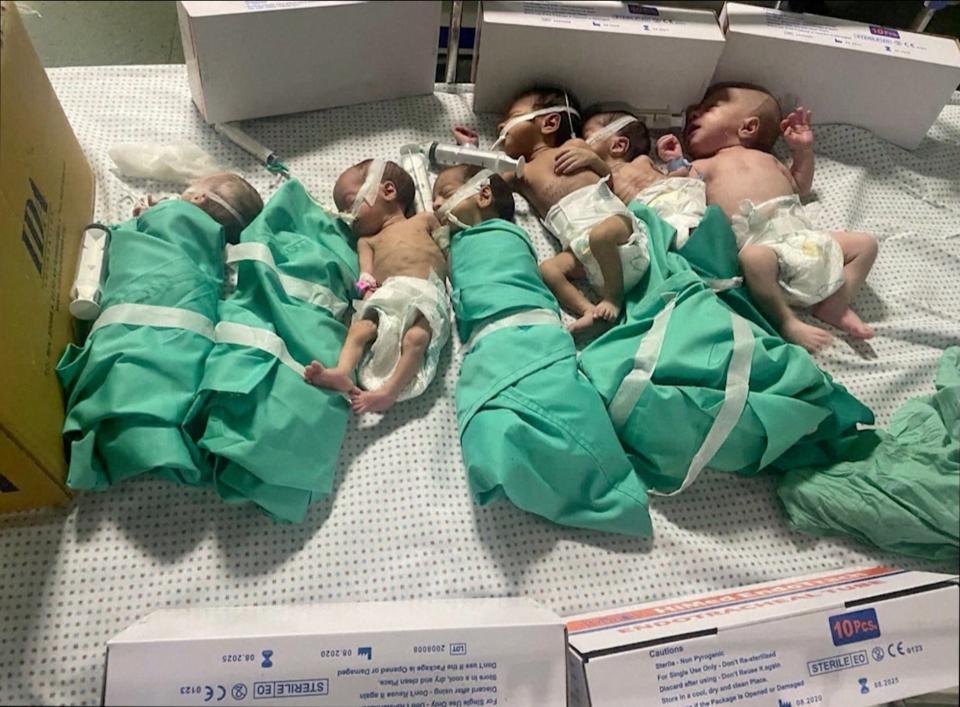 Newborns were pictured in bed after being taken off incubators in Gaza's Al Shifa hospital after power outage (via REUTERS)