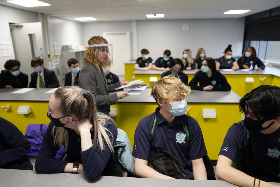 Children and teacher in Year 11 wearing facemasks during lesson at Our Lady and St Bede Catholic Academy in Stockton-on-Tees in County Durham, as pupils in England return to school for the first time in two months as part of the first stage of lockdown easing. Picture date: Monday March 8, 2021. (Photo by Owen Humphreys/PA Images via Getty Images)