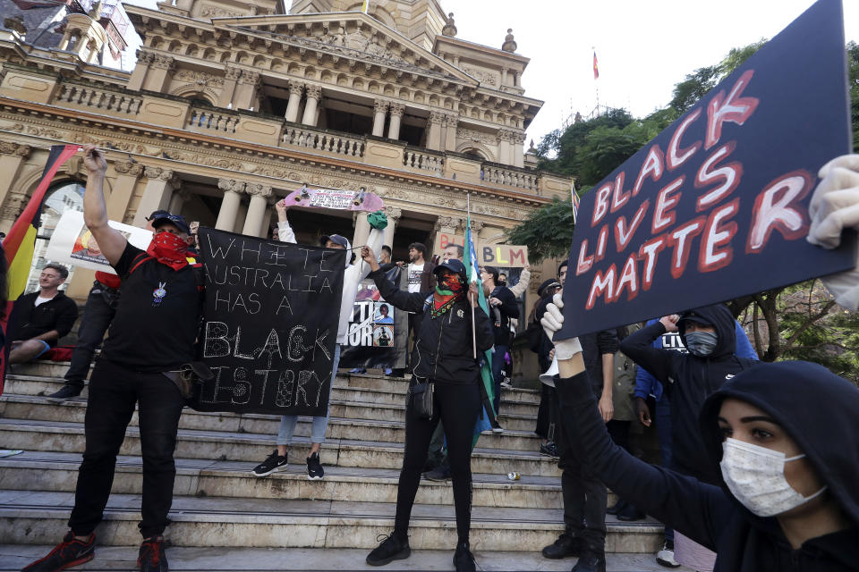 FILE - In this June 6, 2020, file photo, protesters gather at Town Hall in Sydney, to support the cause of U.S. protests over the death of George Floyd. Black Lives Matter has gone mainstream — and black activists are carefully assessing how they should respond. (AP Photo/Rick Rycroft, File)
