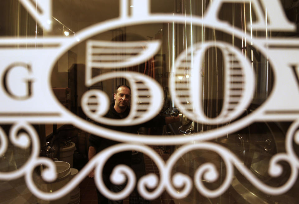 In this Monday, Oct. 8, 2012 photo, Anthony Cavallo, owner of the restaurant Vintage 50, poses for a portrait in the microbrewery of his restaurant in Leesburg, Va. As a small businessman, he doesn't relate to President Barack Obama or Mitt Romney. "Neither one of them has ever really walked in my shoes," Cavallo adds. But he was swayed by the first presidential debate. Before, he says, "I thought Romney was a wuss. He wasn't coming on strong." But he admired the Republican nominee's "aggressive" performance, and is now leaning toward him. (AP Photo/Jacquelyn Martin)