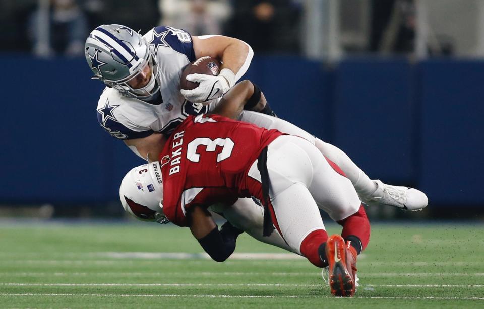 Jan 2, 2022; Arlington, Texas, USA; Arizona Cardinals safety Budda Baker (3) tackles Dallas Cowboys tight end Dalton Schultz (86) in the second quarter at AT&T Stadium. Mandatory Credit: Tim Heitman-USA TODAY Sports