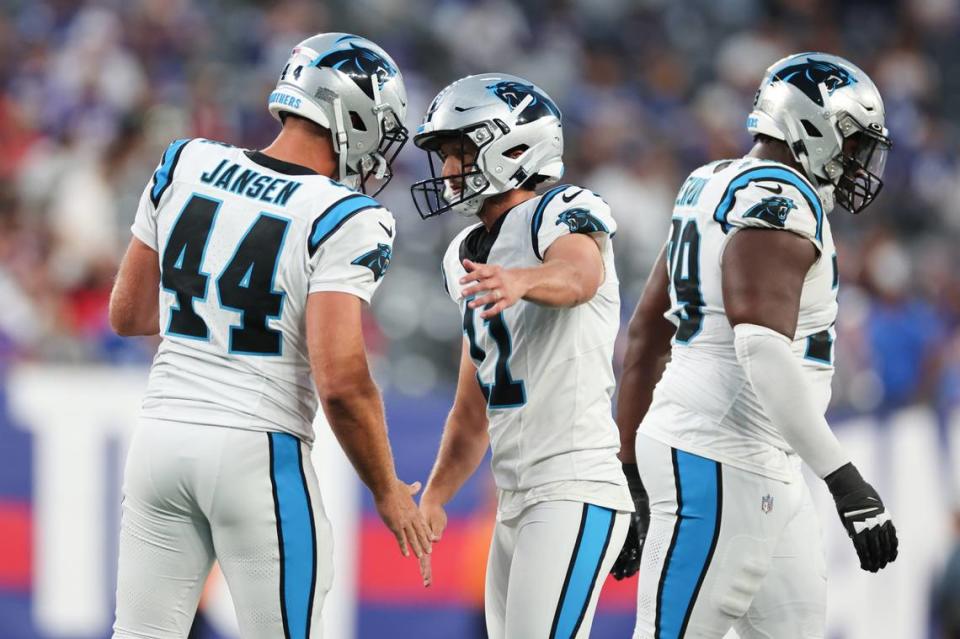 Aug 18, 2023; East Rutherford, New Jersey, USA; Carolina Panthers place kicker Matthew Wright (11) celebrates after a field goal with long snapper JJ Jansen (44) during the first half against the New York Giants at MetLife Stadium. Mandatory Credit: Vincent Carchietta-USA TODAY Sports
