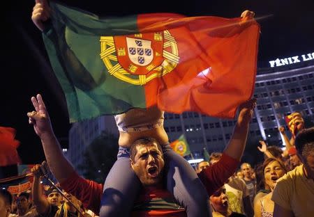 Fans of Portugal react after the Euro 2016 final between Portugal and France in Lisbon, Portugal, July 10, 2016. REUTERS/Pedro Nunes