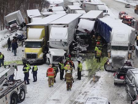 Trucks and passenger vehicles block eastbound Interstate 94 following a massive crash that killed three people and injured about 20 near Michigan City, Indiana January 23, 2014. REUTERS/Indiana State Police/Handout