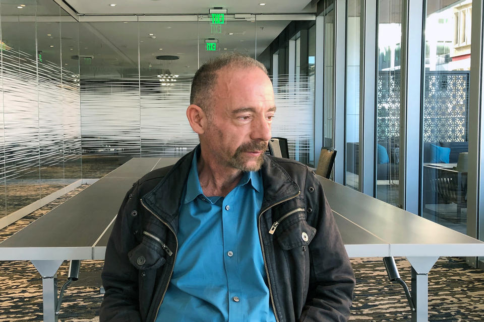 FILE - In this Monday, March 4, 2019 file photo, Timothy Ray Brown poses for a portrait in Seattle. Brown, an American who was known for years as the Berlin patient, had a transplant in Germany from a donor with natural resistance to the AIDS virus. It was thought to have cured Brown's leukemia and HIV. But in an interview Thursday, Sept. 24, 2020, Brown said his cancer returned last year and has spread widely. His case has inspired scientists to seek more practical ways to try to cure the disease. (AP Photo/Manuel Valdes)