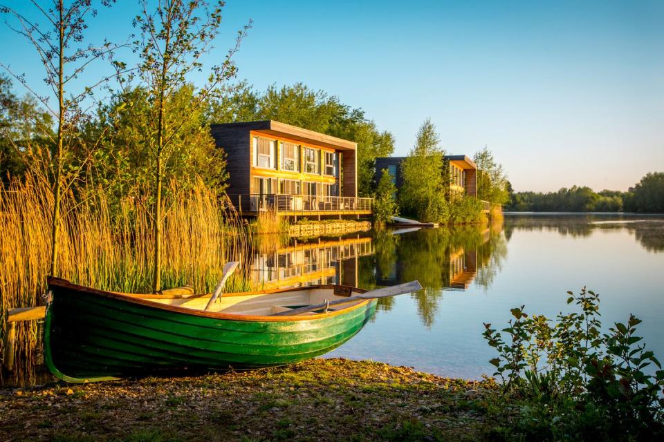 a boat on the water at lakes by yoo cotswolds