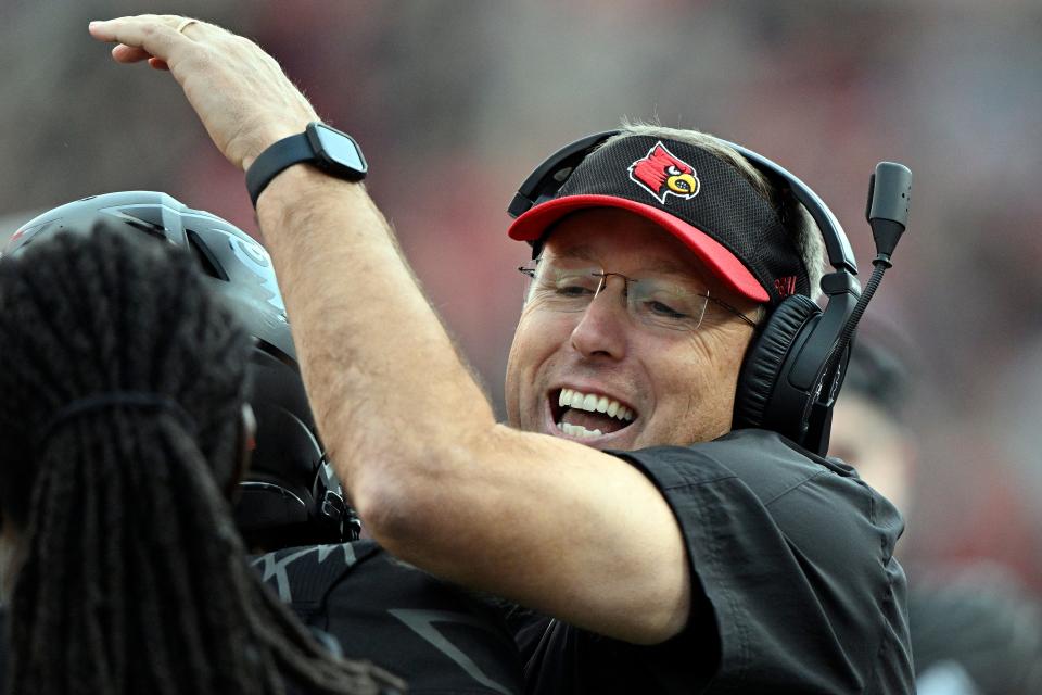 Oct 29, 2022; Louisville, Kentucky, USA;  Louisville Cardinals head coach Scott Satterfield celebrates on the sideline after a touchdown against the Wake Forest Demon Deacons during the second half at Cardinal Stadium. Louisville won 48-21. Mandatory Credit: Jamie Rhodes-USA TODAY Sports
