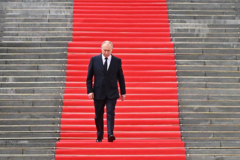 Russian President Vladimir Putin walks down the steps to address troops from the Armed Forces, National Guard, FSB security service and interior ministry gathered on the Sobornaya (Cathedral) Square in central Moscow on June 27, 2023. (Photo by Sergei Guneyev/SPUTNIK/AFP via Getty Images)