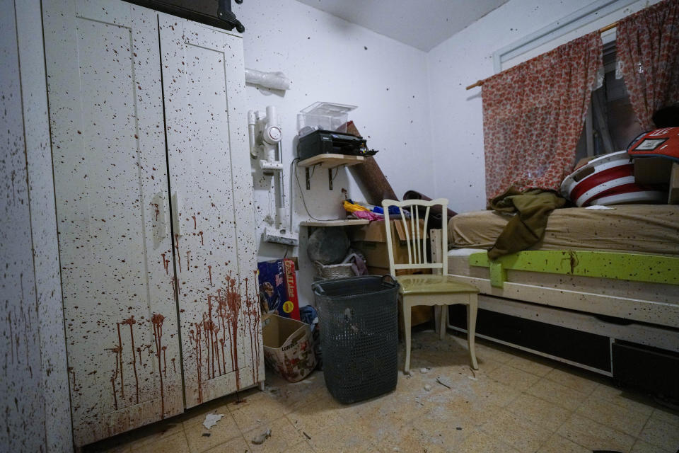 CORRECTS DATE FROM OCT. 16 TO OCT 26 - Blood is seen splattered in a bedroom following a massive Hamas militant attack in Kibbutz Ein Hashlosha, Israel, Thursday, Oct. 26, 2023. Ein Hashlosha is one of more than 20 towns and villages in southern Israel that were ambushed in the sweeping assault by Hamas militants on Oct. 7, when more than 1,400 people were killed and over 220 captured. (AP Photo/Tsafrir Abayov)