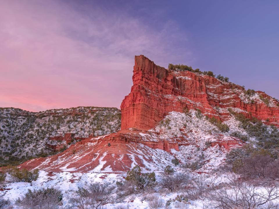 Winter sunrise on the face of a rock outcropping in the caprock canyons of West Texas.