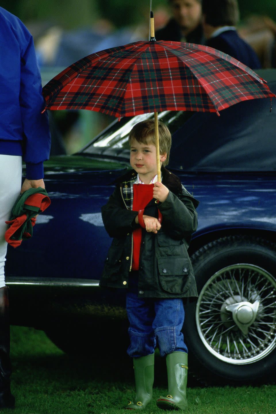 <p>From a young age, Prince William knew that a plaid umbrella was the perfect accessory for a pair of Wellies and a Barbour jacket.</p>