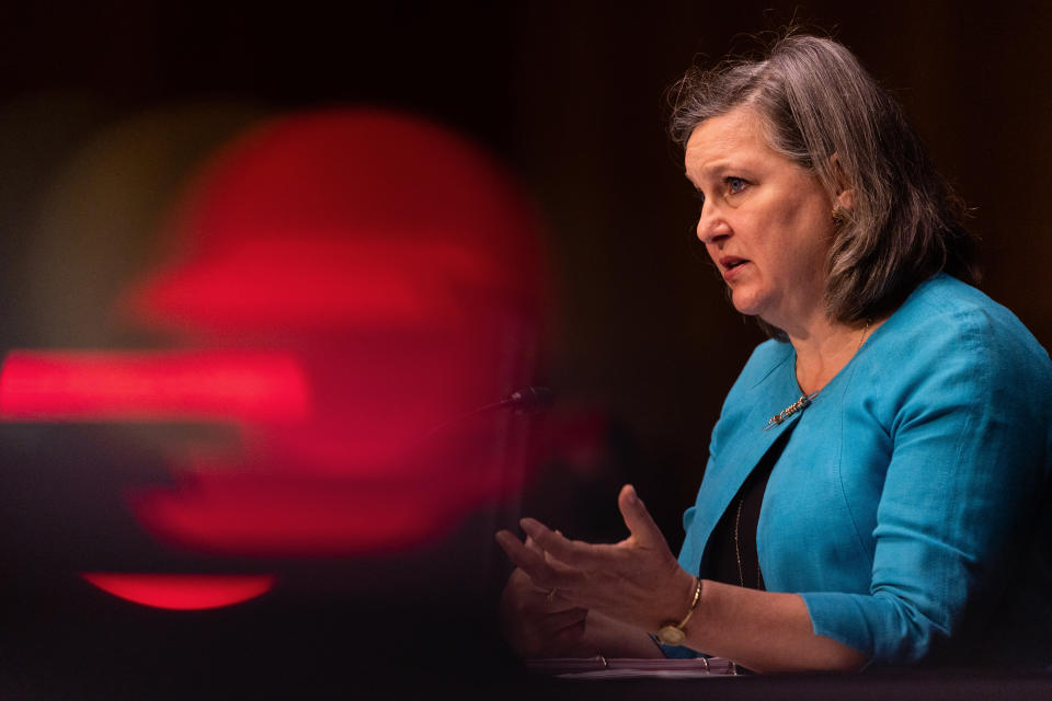 Victoria Nuland, undersecretary of state for political affairs gestures as she answers a question at a hearing. 