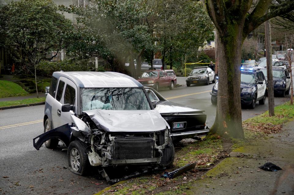 A wrecked vehicle is seen after a driver struck and injured at least six people over a 20-block stretch before crashing on Monday in Portland, Ore.