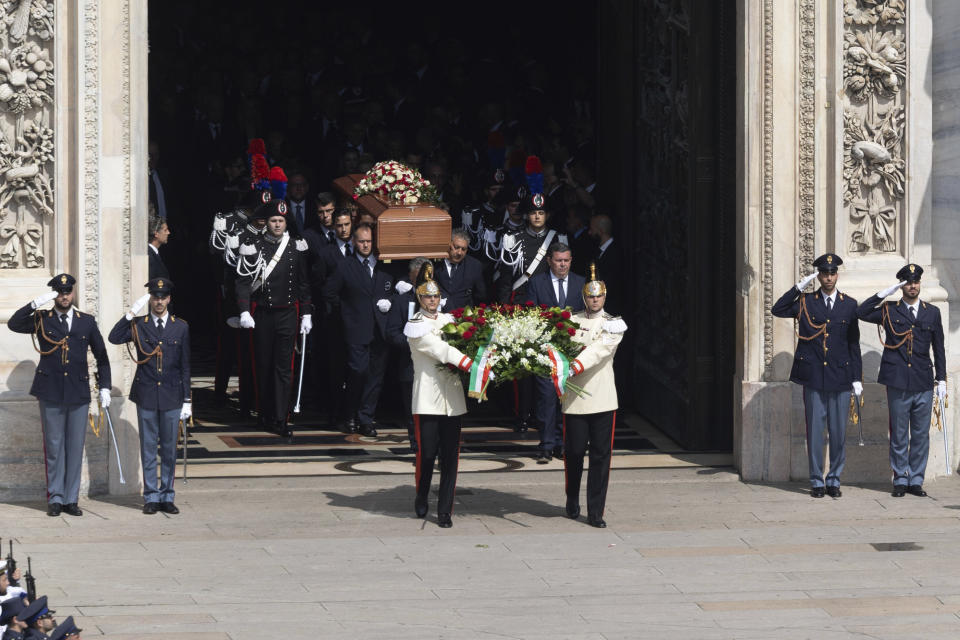 The casket of former Italian premier Silvio Berlusconi is carried out at the end of his state funeral in Milan's Duomo Gothic-era Cathedral, Italy, Wednesday, June 14, 2023. Berlusconi died at the age of 86 on Monday in a Milan hospital where he was being treated for chronic leukemia. (Stefano Porta/LaPresse via AP)