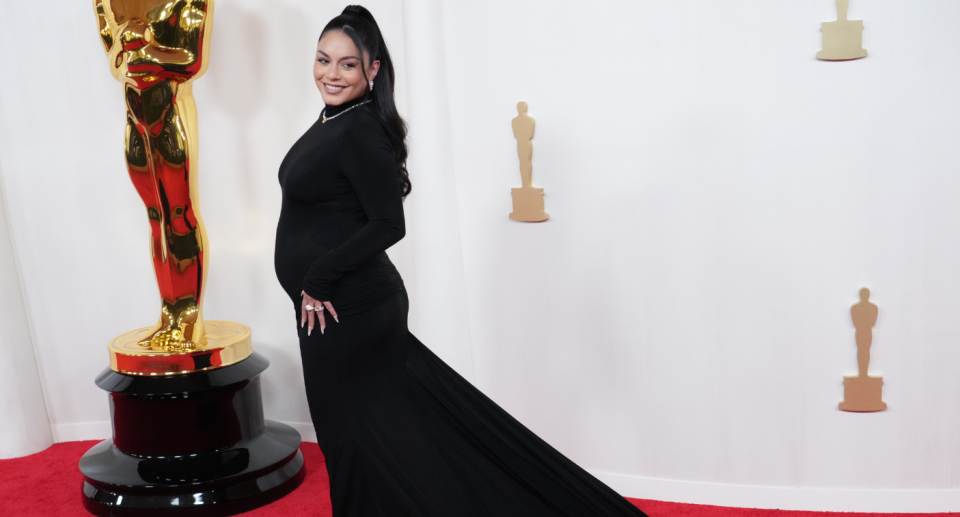 Vanessa Hudgens revealed she is expecting her first child in a custom Vera Wang gown. Credit: Getty Images. 