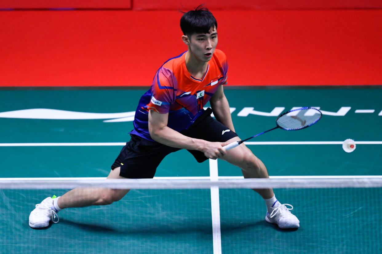 Singapore shuttler Loh Kean Yew retrieves a shot at the BWF World Tour Finals in Bangkok. 